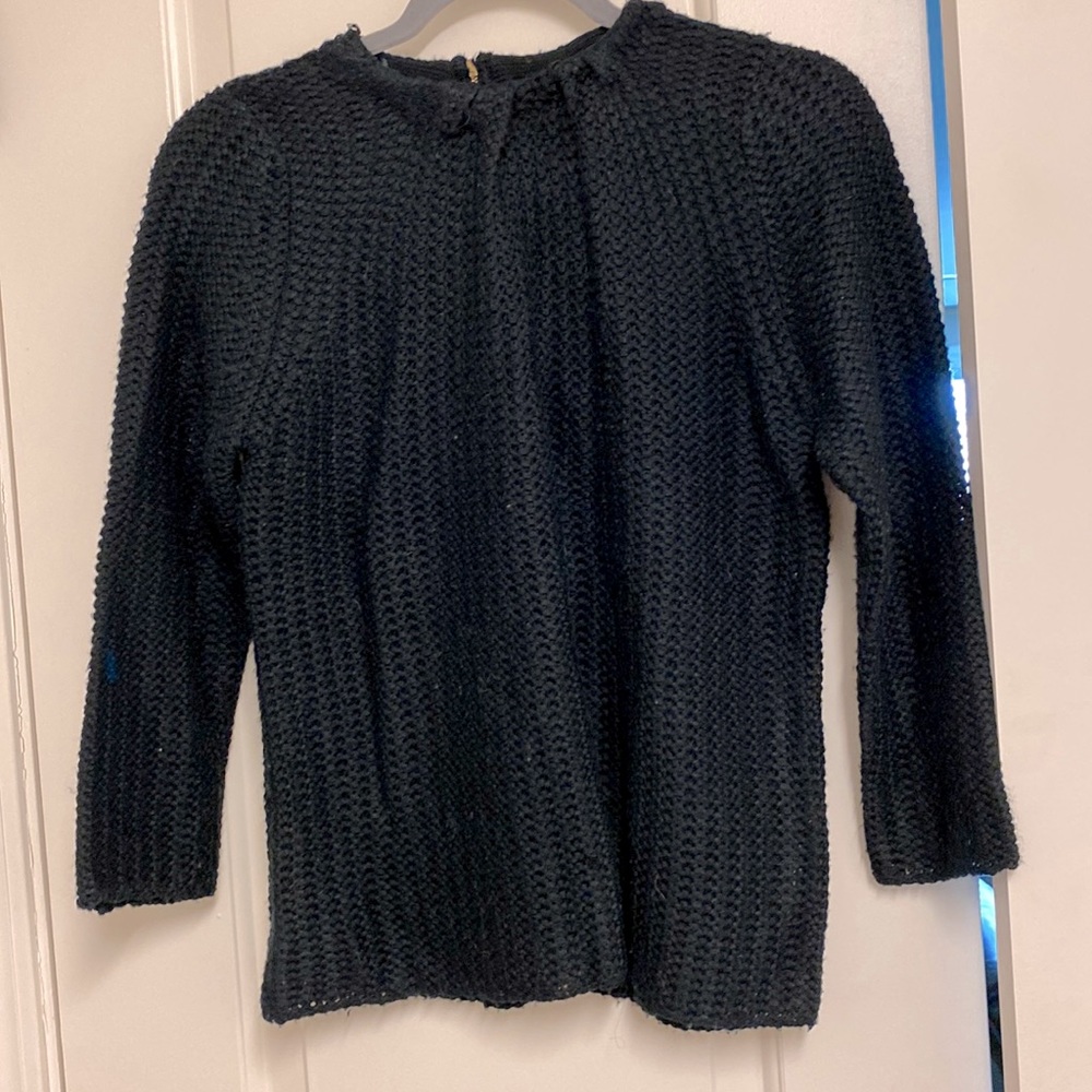 Black 3/4 length cable sweater. Fitted sweater. 3/4 zip in back.